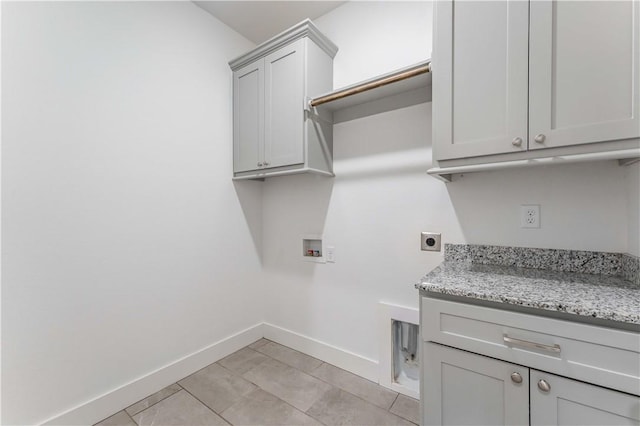 laundry room featuring washer hookup, cabinet space, light tile patterned floors, baseboards, and hookup for an electric dryer