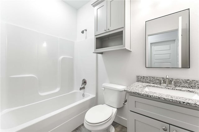 bathroom with shower / bath combination, toilet, vanity, and baseboards