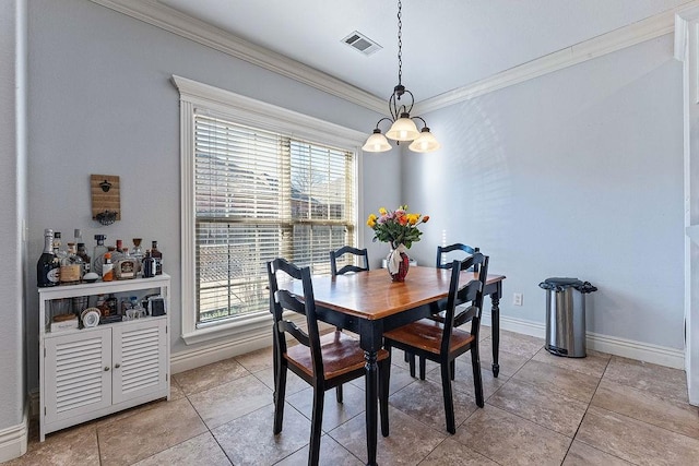 dining space with light tile patterned floors, visible vents, crown molding, and baseboards