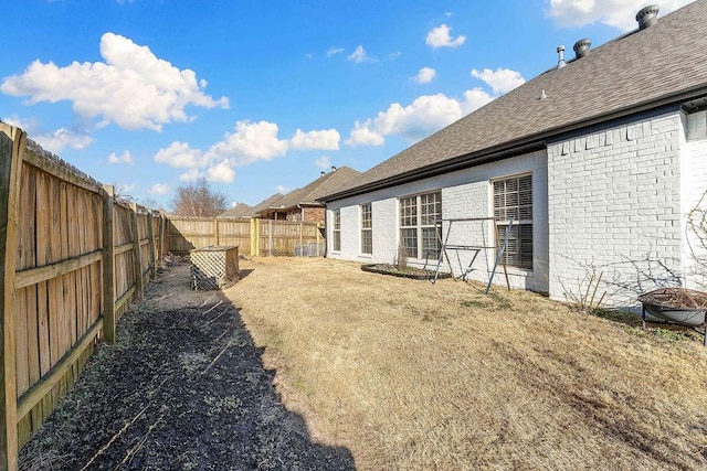 view of yard with a fenced backyard