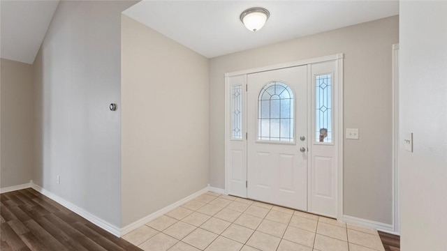 entryway featuring baseboards