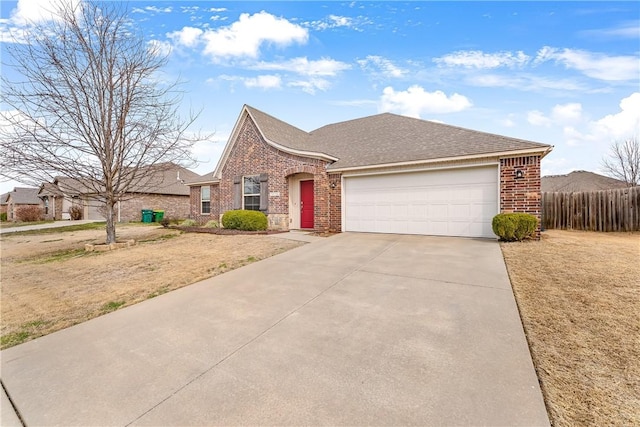 view of front of home featuring brick siding, a shingled roof, fence, concrete driveway, and an attached garage