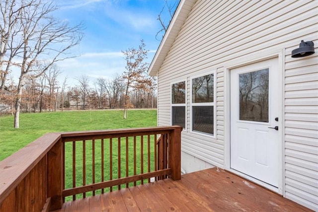 wooden deck with a lawn