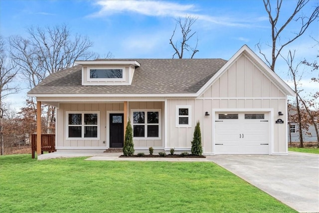 modern farmhouse style home featuring a front yard, driveway, roof with shingles, an attached garage, and board and batten siding