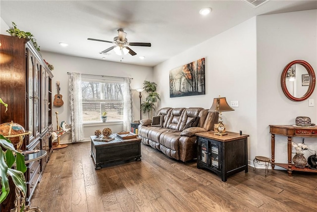 living area featuring hardwood / wood-style flooring, recessed lighting, a ceiling fan, and baseboards