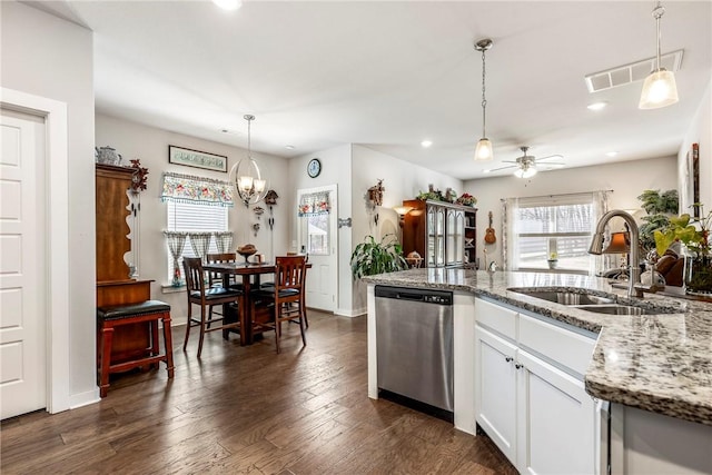 kitchen with a ceiling fan, visible vents, dark wood finished floors, a sink, and dishwasher