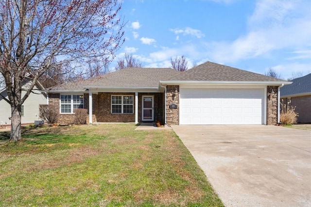 ranch-style house with a front yard, driveway, an attached garage, a shingled roof, and brick siding