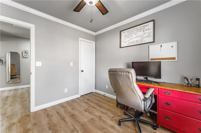 office space featuring baseboards, crown molding, a ceiling fan, and wood finished floors