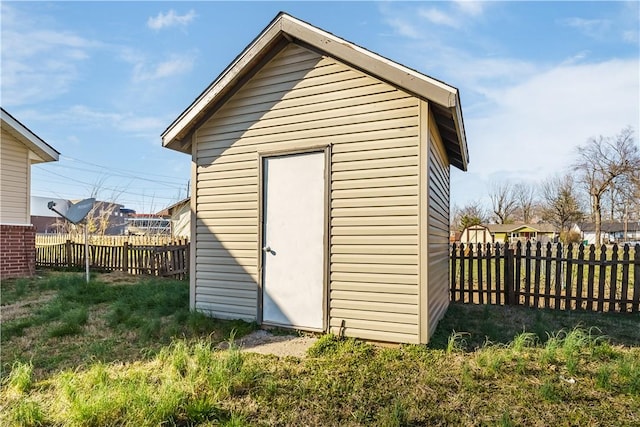 view of shed with a fenced backyard