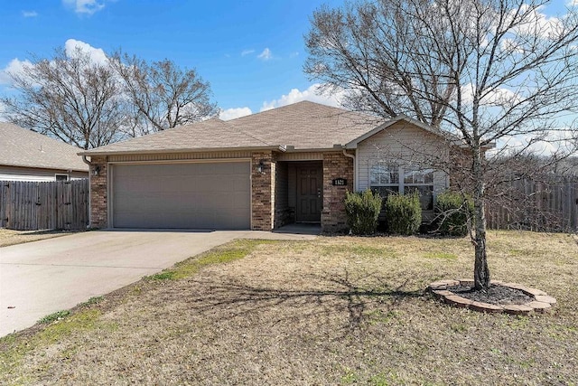 single story home with driveway, fence, roof with shingles, a garage, and brick siding