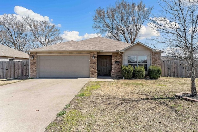 ranch-style home with fence, roof with shingles, an attached garage, concrete driveway, and brick siding