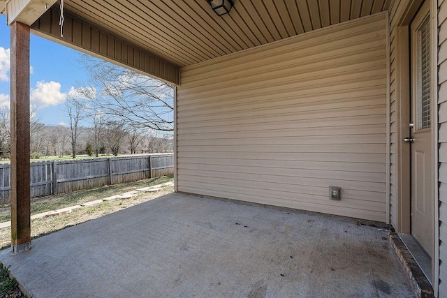 view of patio featuring fence