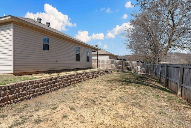 view of yard with a fenced backyard