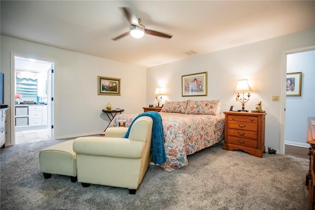 bedroom with visible vents, carpet floors, baseboards, and connected bathroom