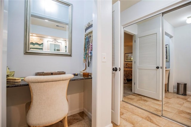 office space with visible vents and baseboards