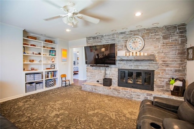 carpeted living room with a fireplace, crown molding, recessed lighting, and ceiling fan