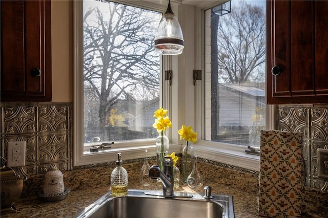 details featuring stone countertops and a sink