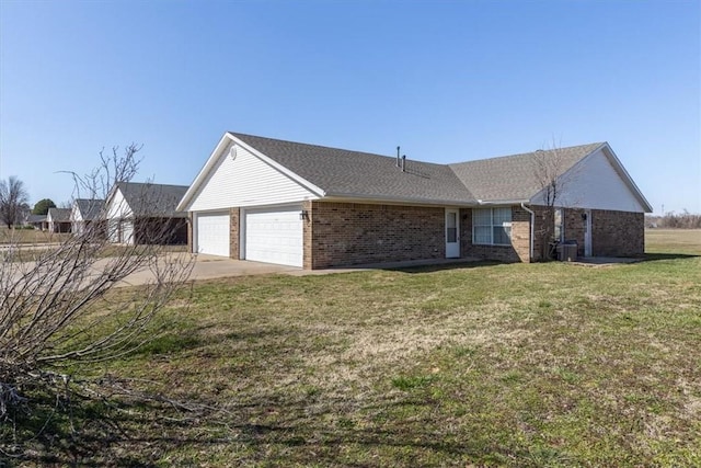 view of front of house with brick siding, central air condition unit, concrete driveway, and a front yard