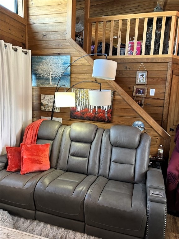 living area featuring wooden walls