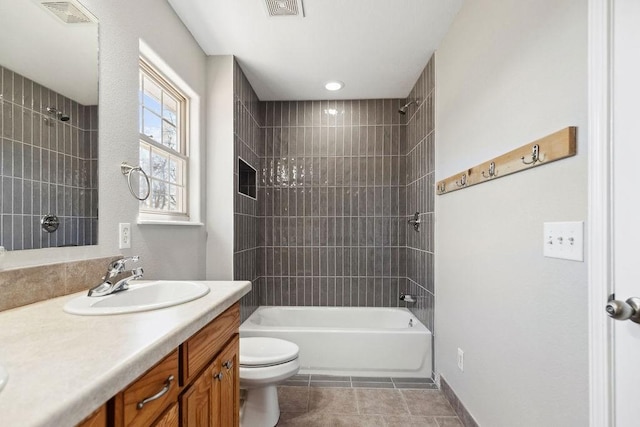 bathroom featuring visible vents, toilet, bathing tub / shower combination, tile patterned floors, and vanity