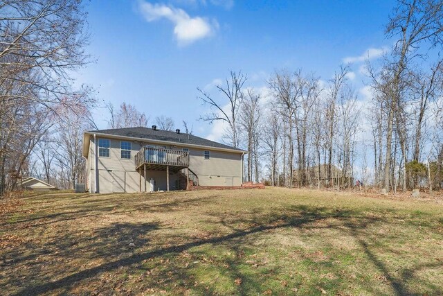 rear view of house featuring a wooden deck, stairs, and a yard