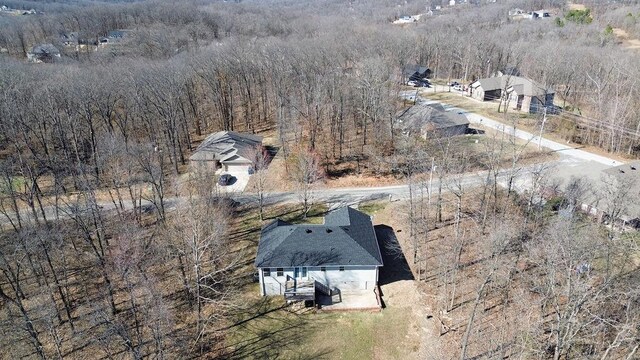 drone / aerial view with a view of trees