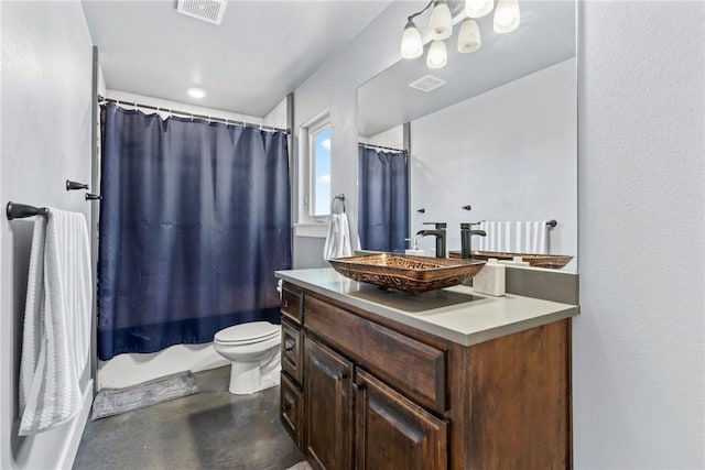 bathroom featuring visible vents, toilet, concrete floors, and vanity