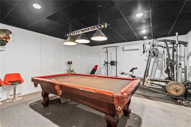 game room featuring a drop ceiling, pool table, an AC wall unit, and carpet