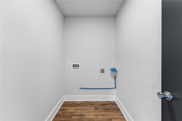 clothes washing area featuring laundry area, dark wood-style flooring, baseboards, and washer hookup