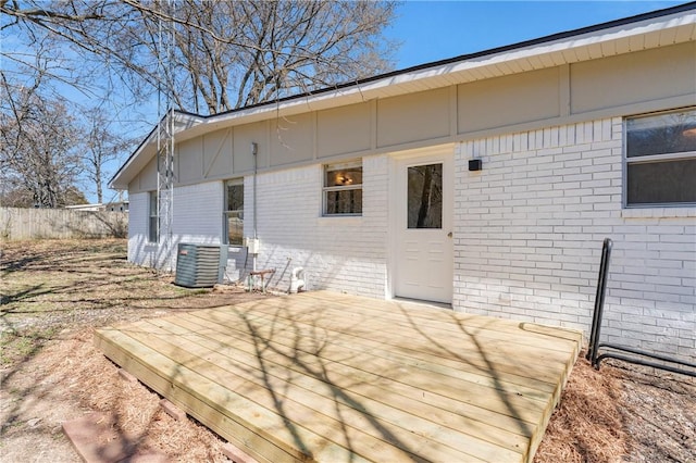 deck featuring fence and central AC