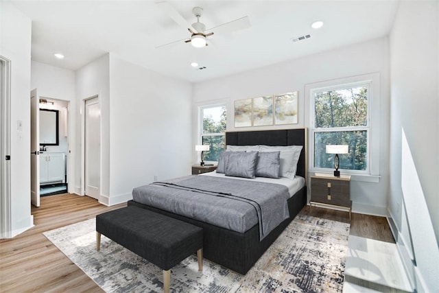 bedroom featuring visible vents, recessed lighting, baseboards, and wood finished floors