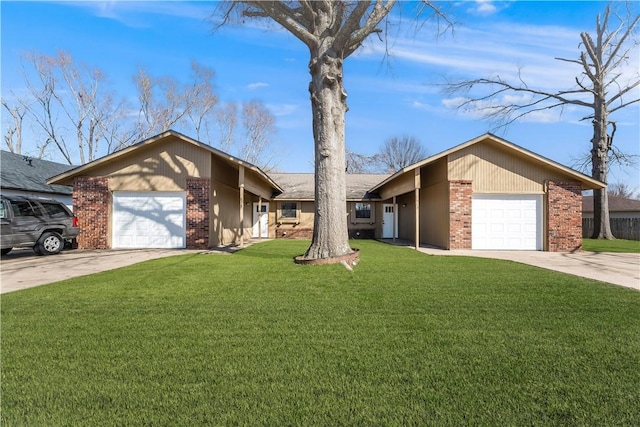 mid-century inspired home with a garage, brick siding, concrete driveway, and a front yard