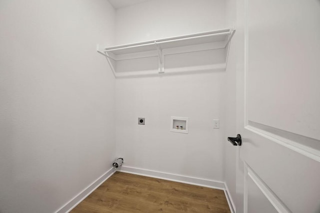 washroom featuring baseboards, laundry area, hookup for a washing machine, wood finished floors, and hookup for an electric dryer