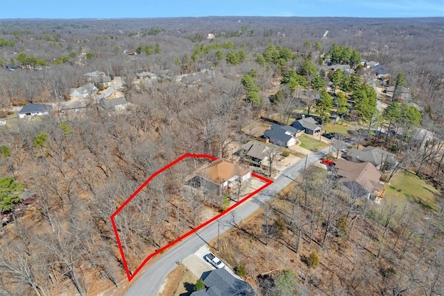 birds eye view of property with a wooded view