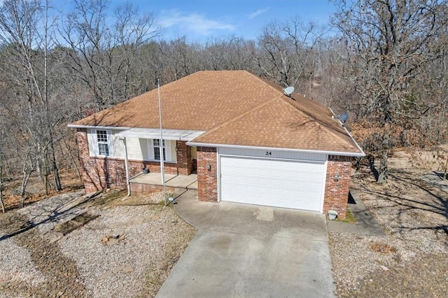 24 Lord Nelson Dr, Bella Vista, AR 72714 - ranch-style home featuring brick siding, driveway, and an attached garage
