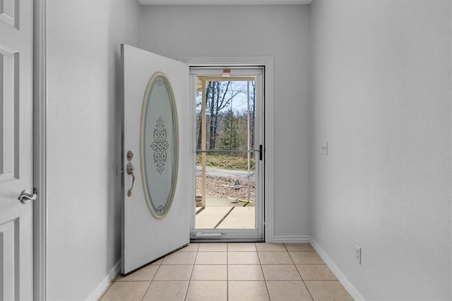 entryway featuring light tile patterned floors and baseboards