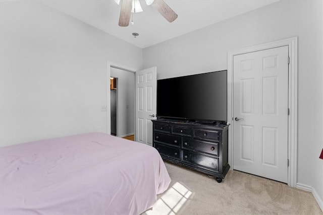 carpeted bedroom with baseboards and ceiling fan