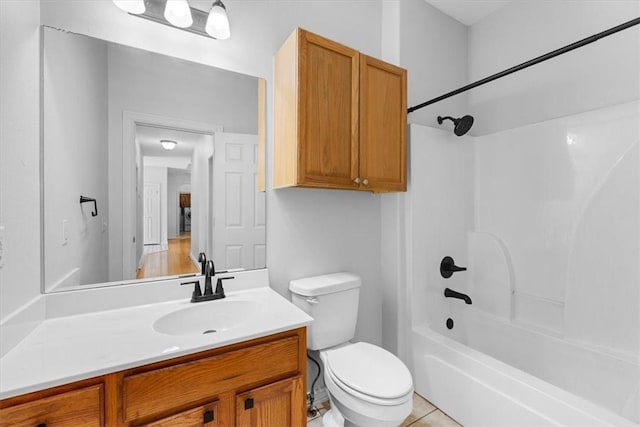 full bathroom featuring tile patterned floors, toilet, shower / washtub combination, and vanity