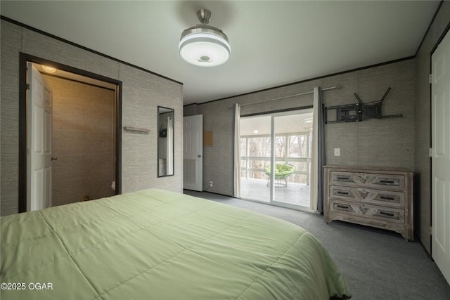 carpeted bedroom with access to exterior and brick wall