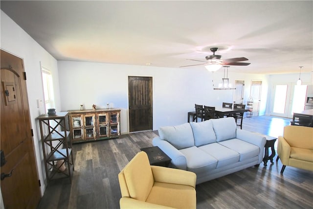 living area with wood finished floors and ceiling fan