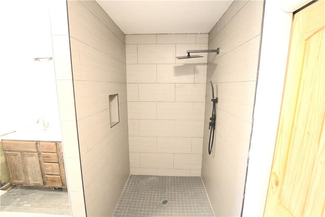 full bath with a tile shower