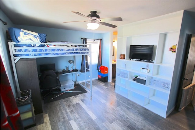 bedroom with a ceiling fan and wood finished floors