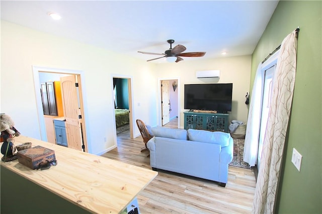 living room with recessed lighting, baseboards, light wood-style floors, and a ceiling fan