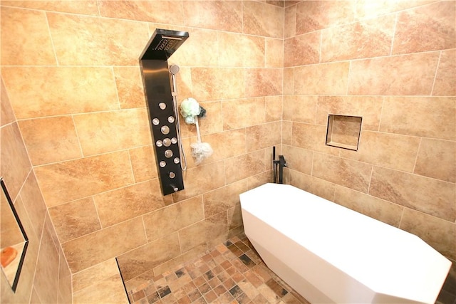 bathroom with a soaking tub