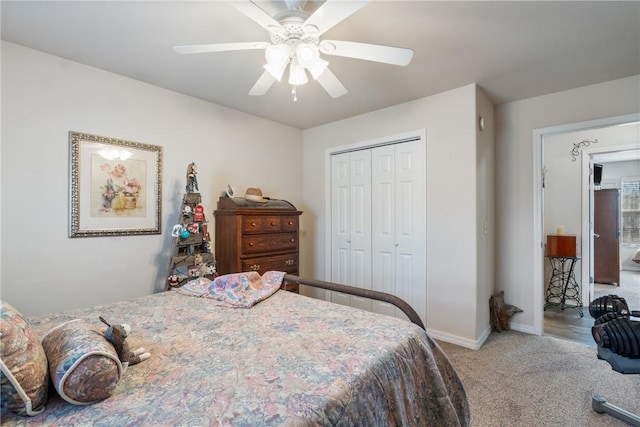 bedroom featuring a closet, baseboards, a ceiling fan, and carpet floors