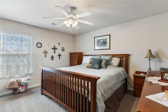 carpeted bedroom featuring a ceiling fan, baseboards, and visible vents