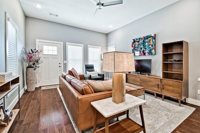 living area featuring visible vents, dark wood finished floors, recessed lighting, baseboards, and ceiling fan