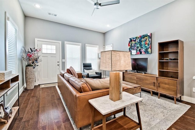 living area featuring recessed lighting, dark wood finished floors, visible vents, baseboards, and ceiling fan