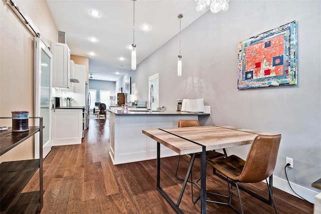 dining space featuring baseboards, dark wood-style floors, and recessed lighting