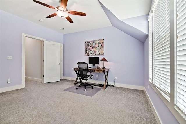 office with baseboards, carpet floors, ceiling fan, and vaulted ceiling